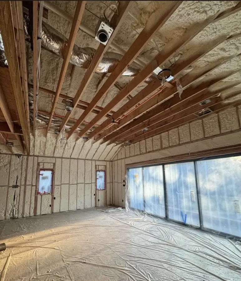 Interior walls and ceiling insulated with spray foam during new construction in Southampton
